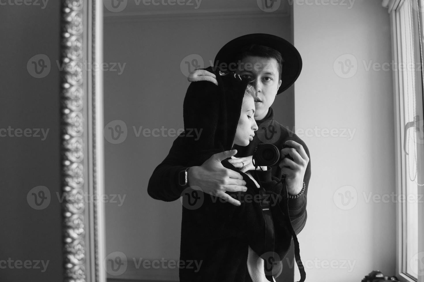 man and woman in black clothes photo