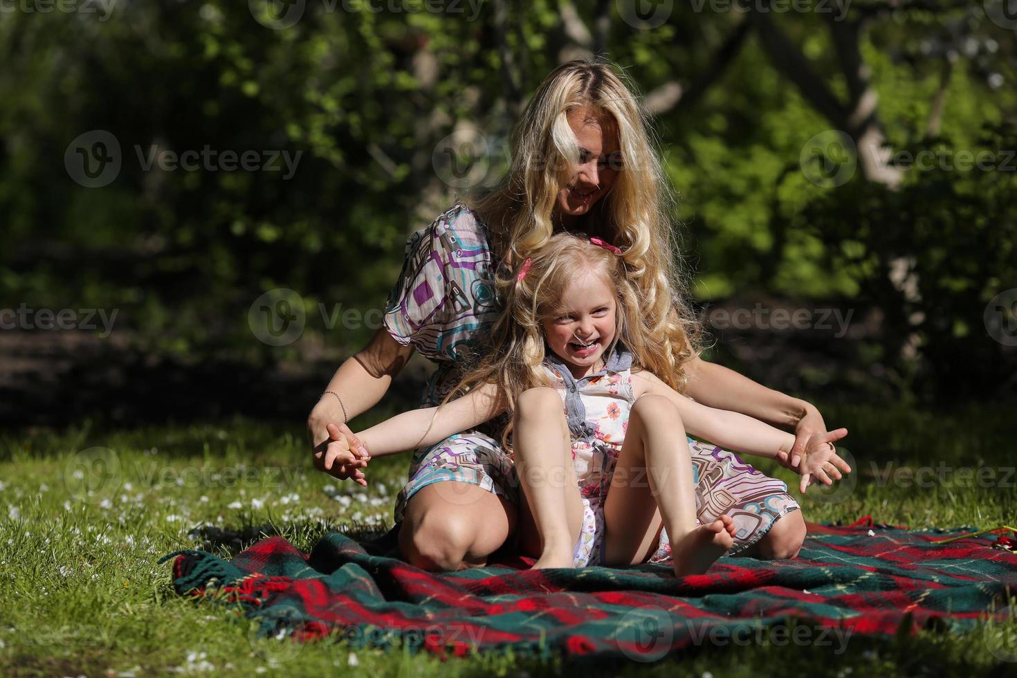 mother and daughter in the garden photo