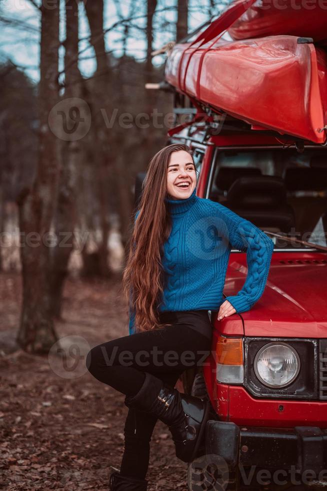 Beautiful young girl posing outdoor on camera photo