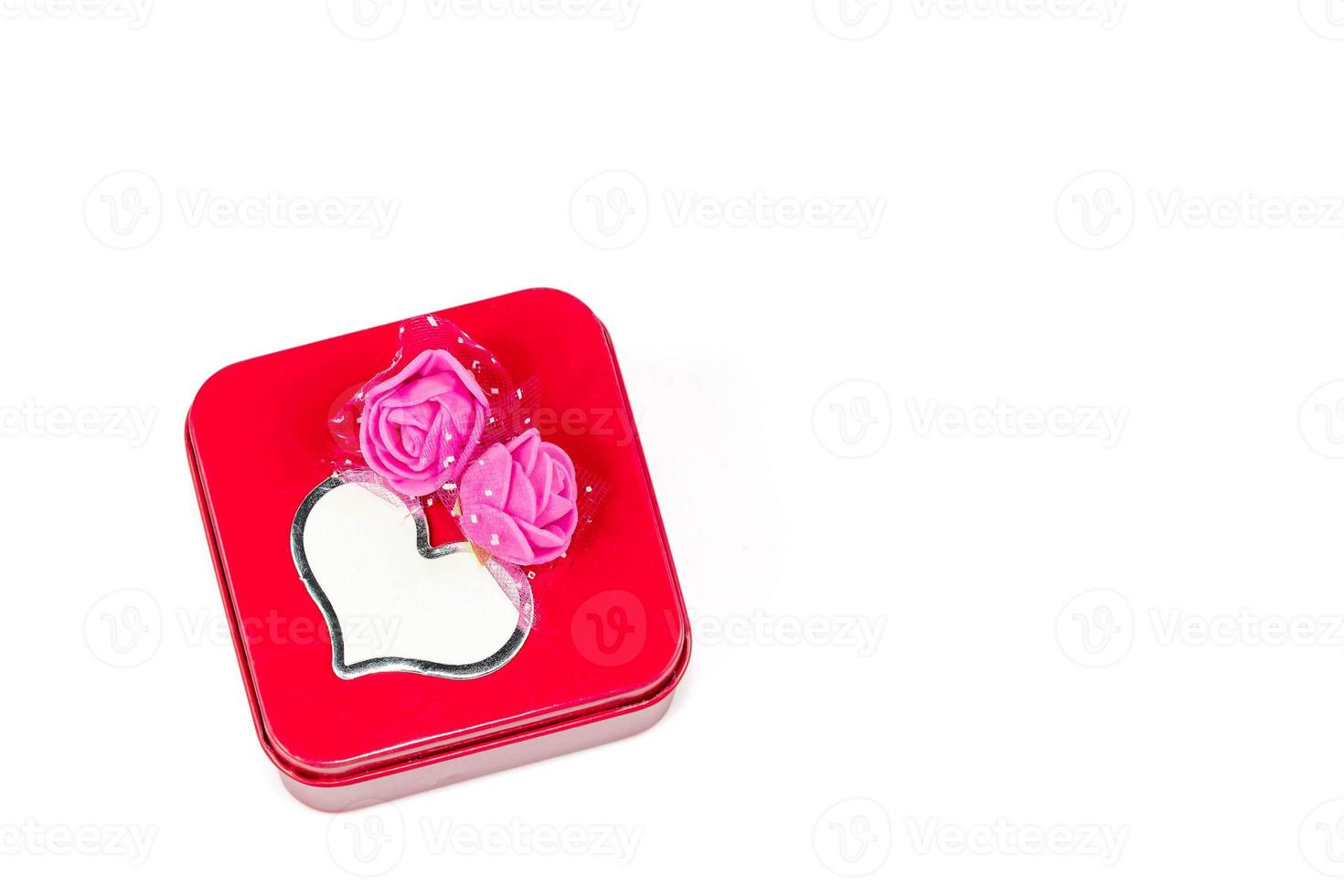 Rectangular iron box, decorated with pink artificial flowers, and a greeting card isolated on white background with Clipping path photo