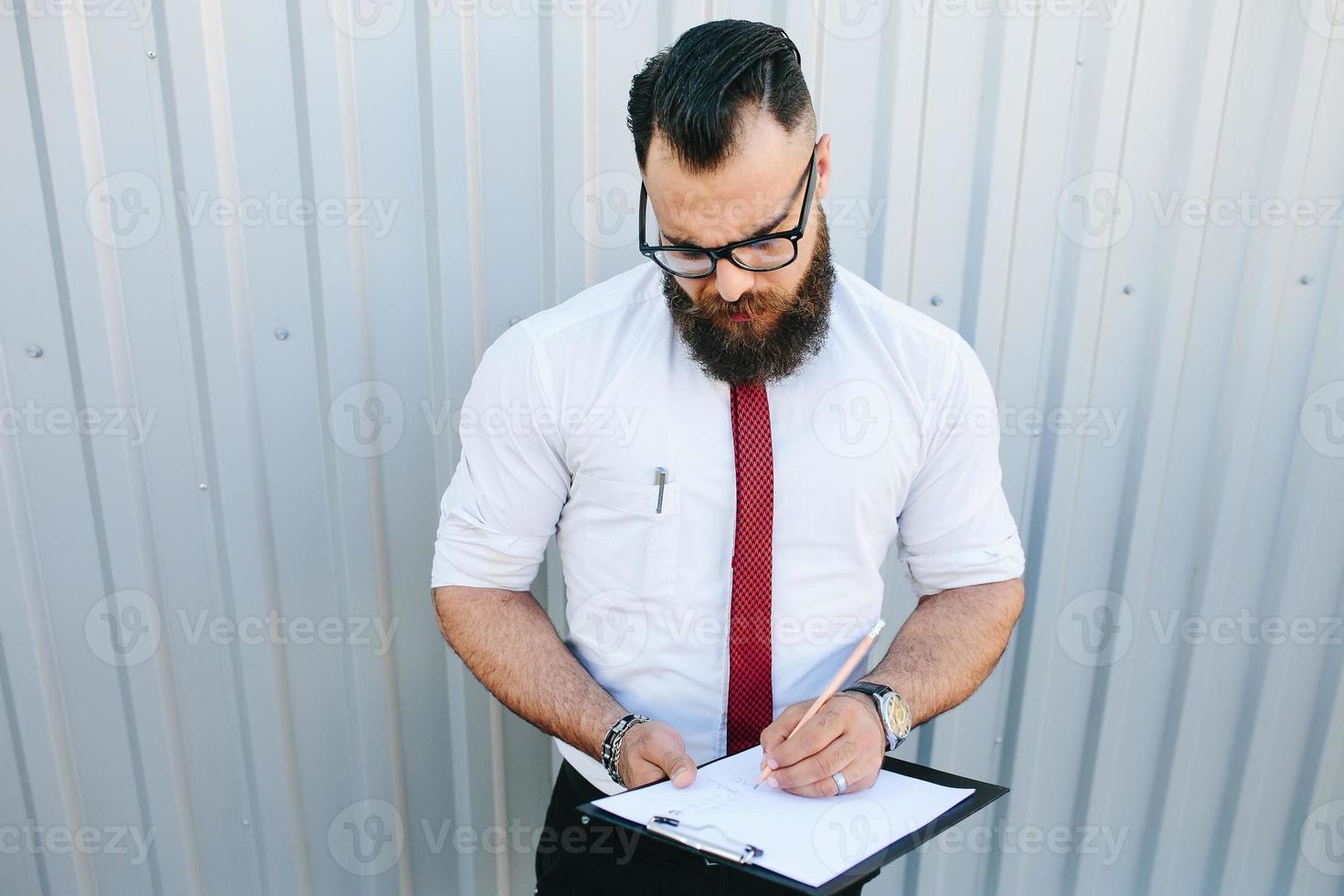 businessman signs a document photo