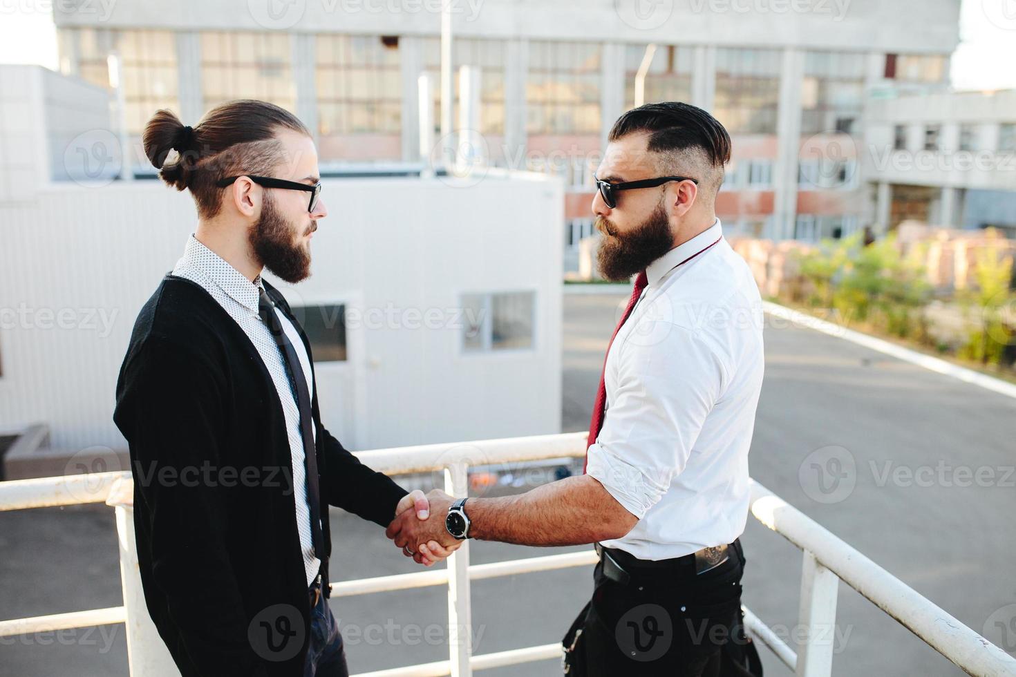 Two businessmen shaking hands photo