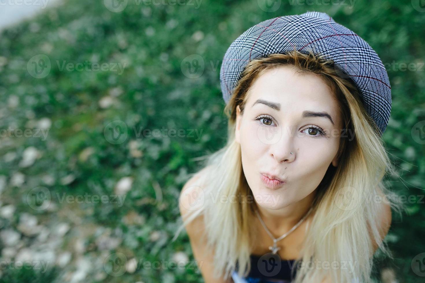 pretty girl sitting and looking at the camera photo