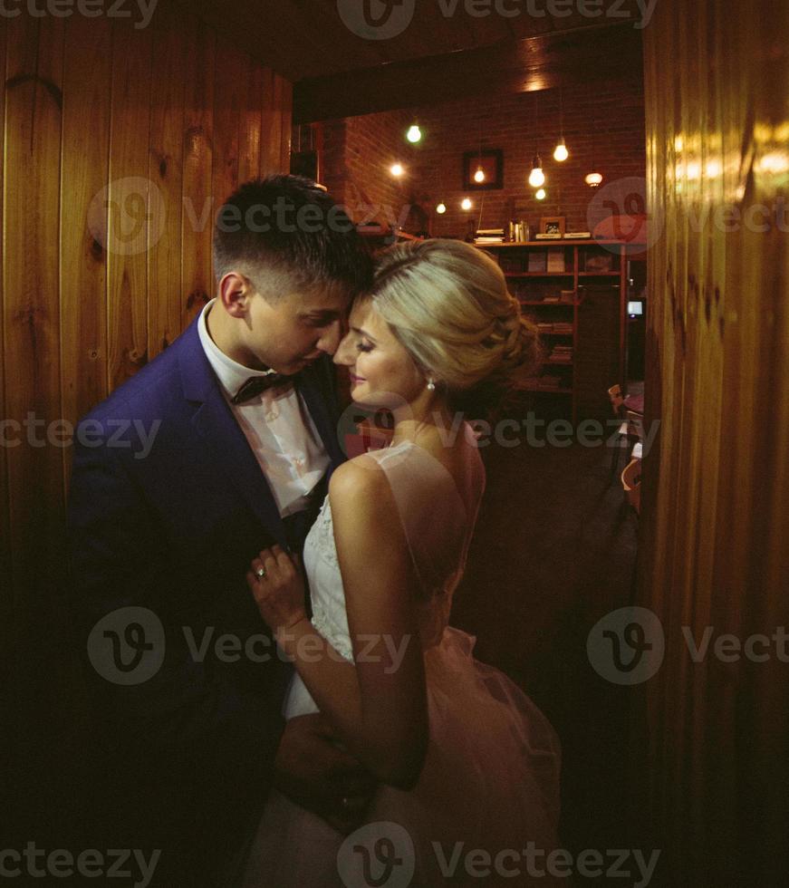 The bride and groom in a cozy house photo