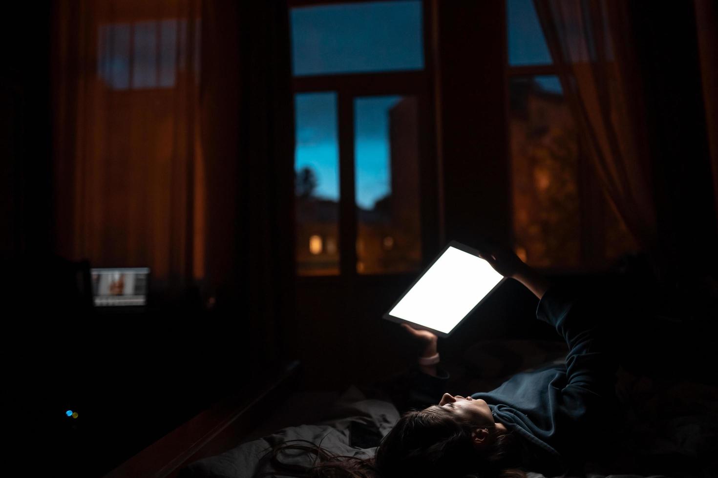 Close up to view woman's hands hold tablet with empty screen. photo