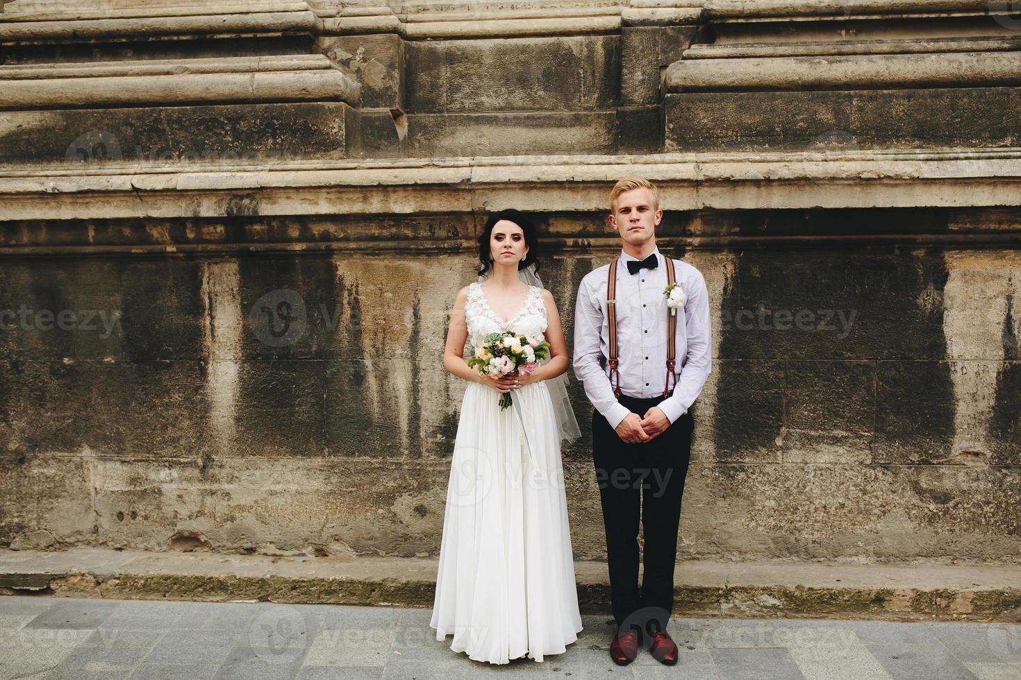 The bride and groom posing photo