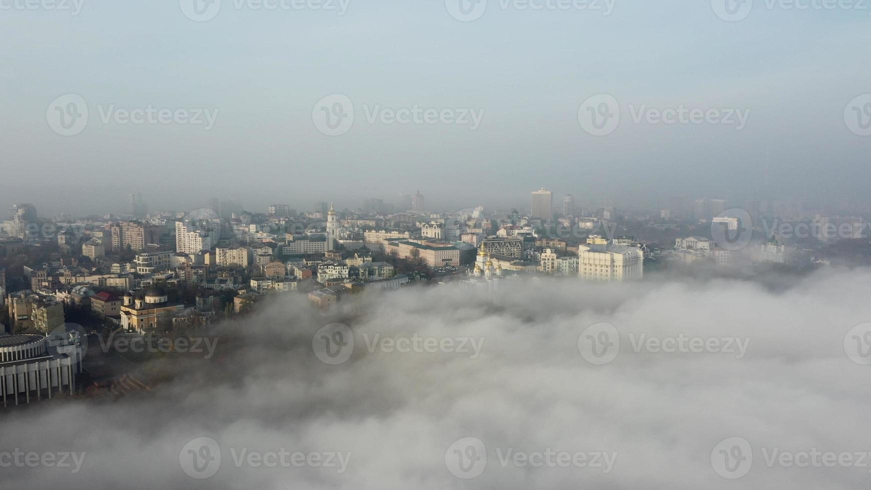 Aerial view of the city in the fog. photo
