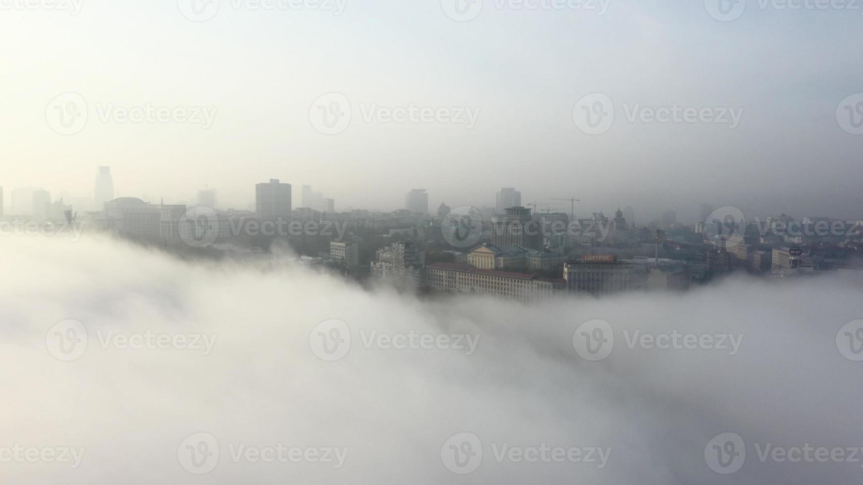 Aerial view of the city in the fog. photo