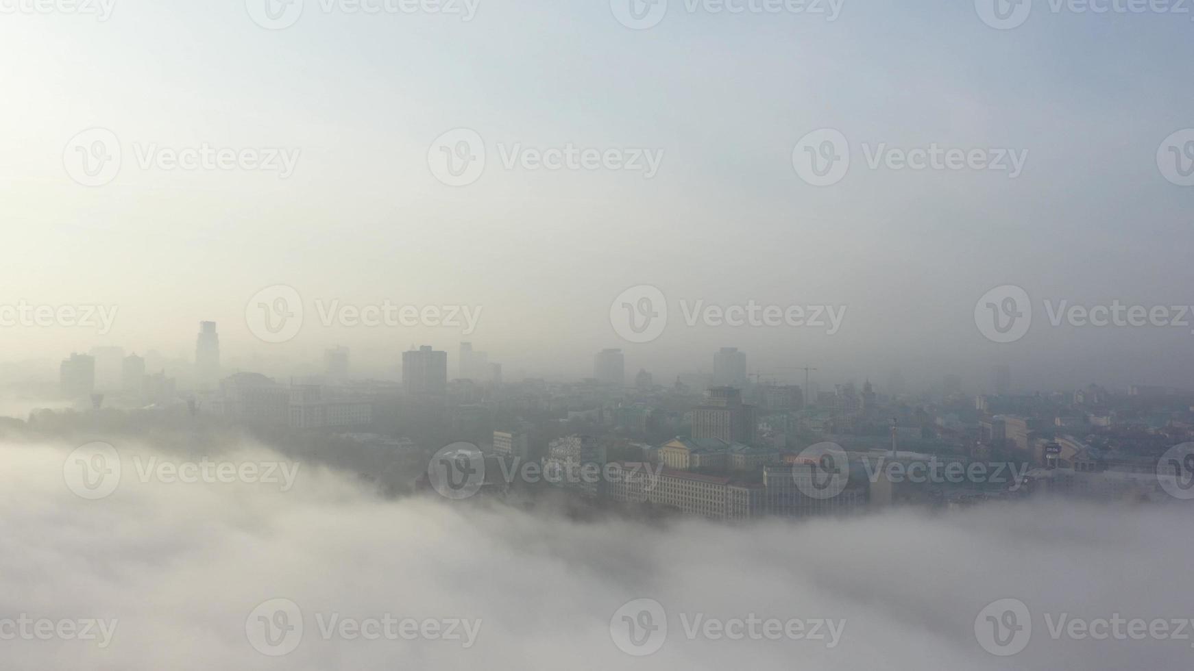 Aerial view of the city in the fog. photo