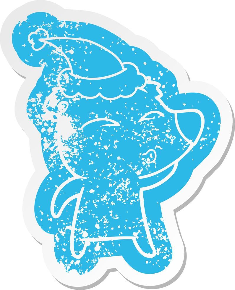 cartoon distressed sticker of a whistling bear wearing santa hat vector