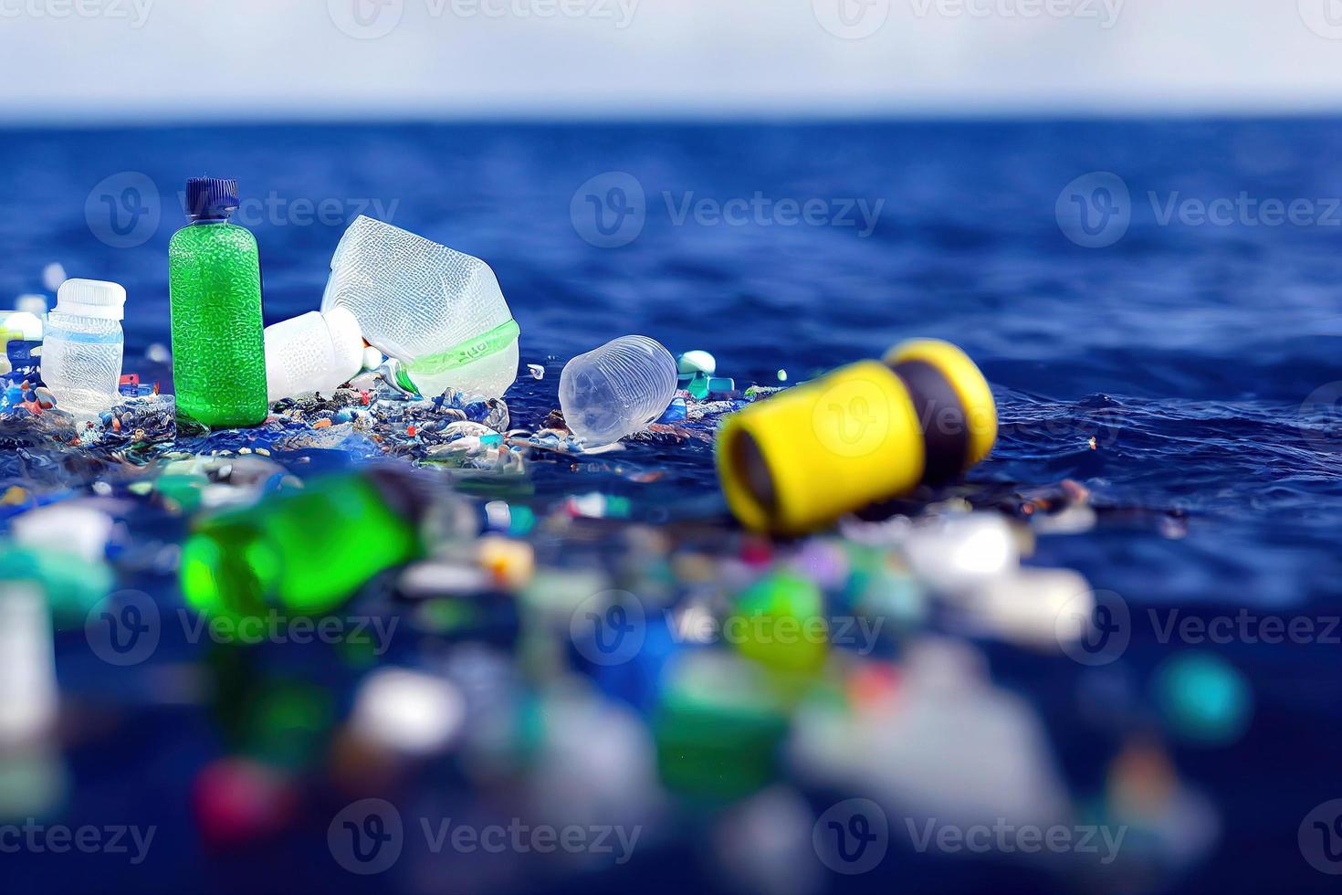 Problem plastic bottles and microplastics floating in the ocean. photo