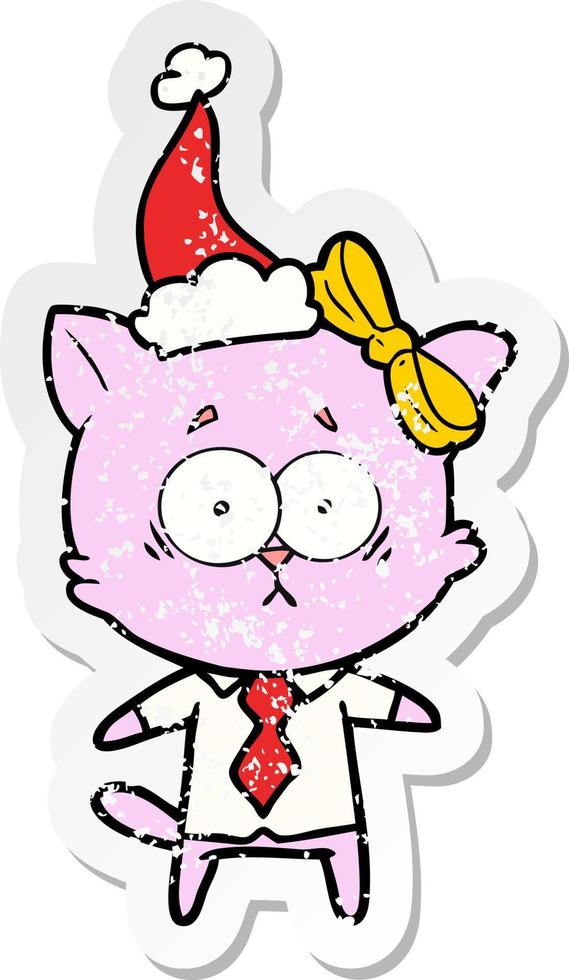 distressed sticker cartoon of a cat wearing santa hat vector