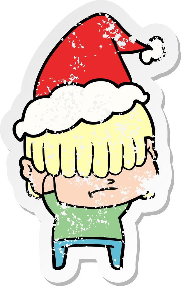 distressed sticker cartoon of a boy with untidy hair wearing santa hat vector