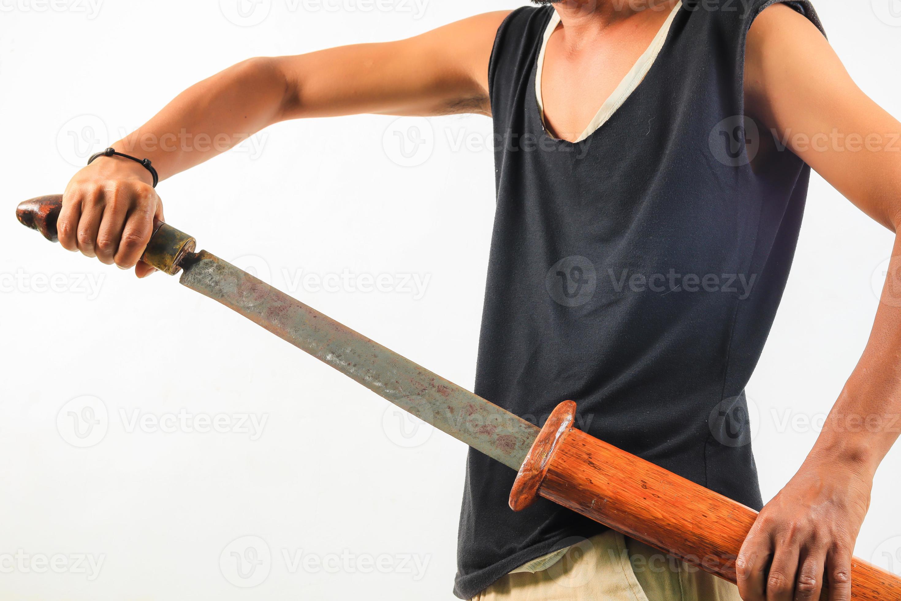 Man holding machete isolated 11505268 Stock Photo at Vecteezy