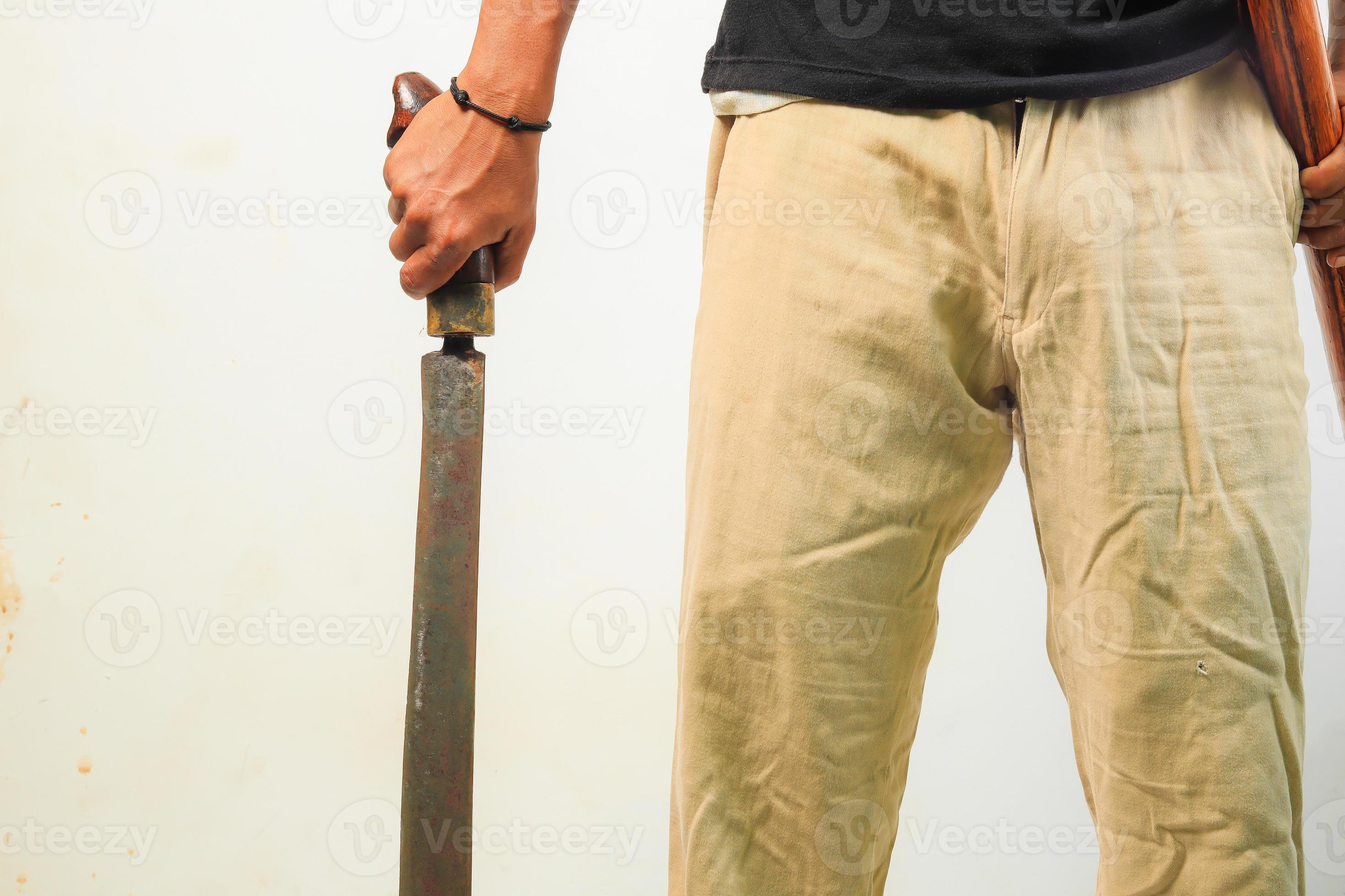 Man holding machete isolated 11505323 Stock Photo at Vecteezy