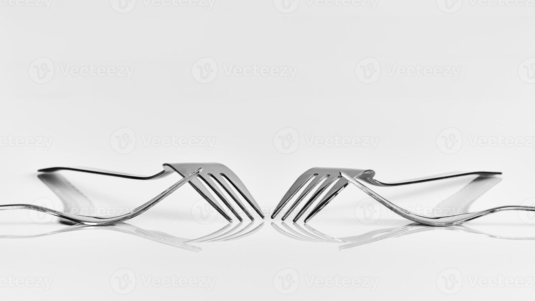 Four forks and reflection photo