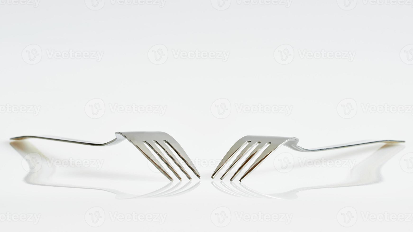 Two forks and reflection photo
