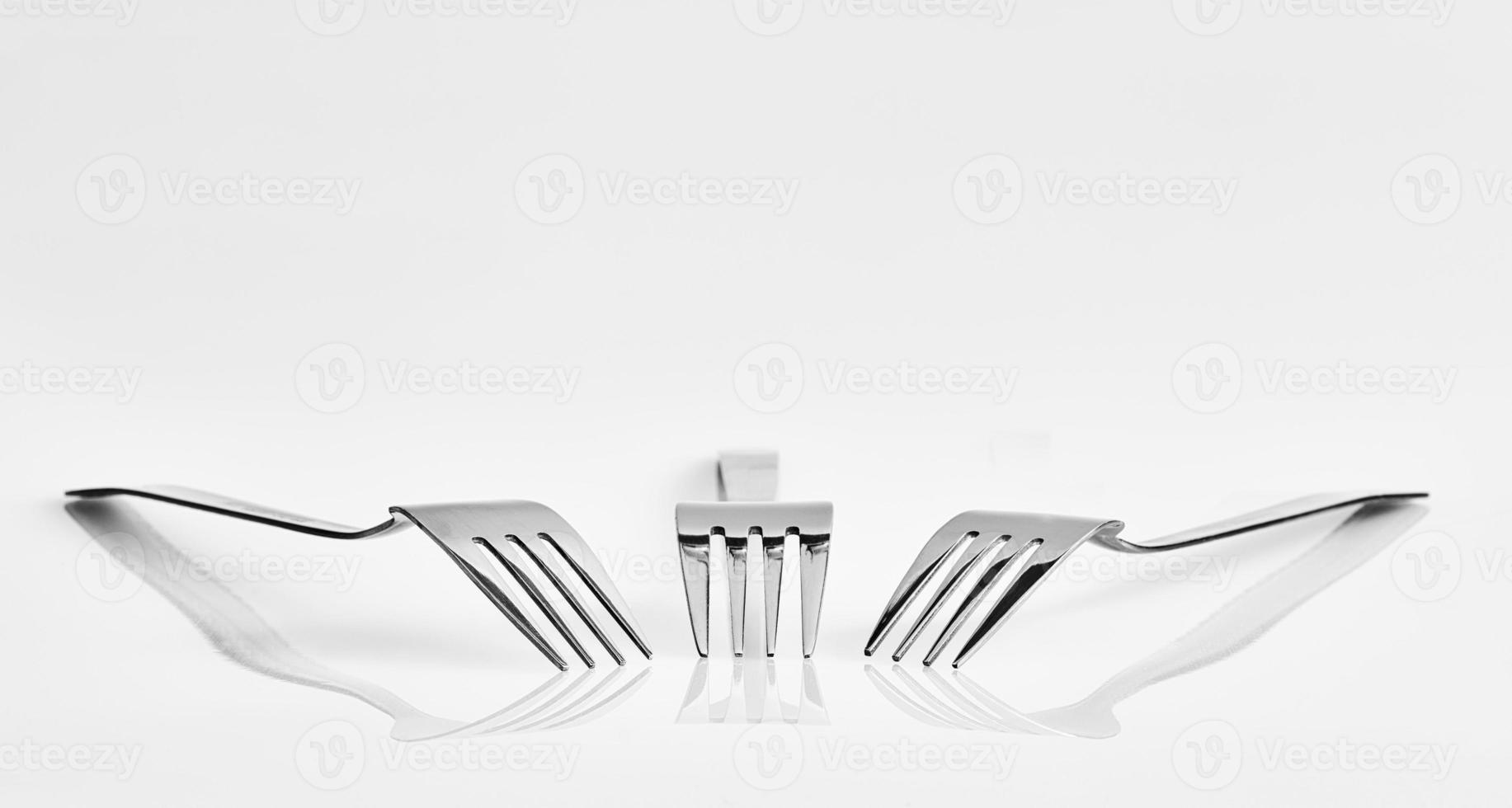 Three forks and reflection photo