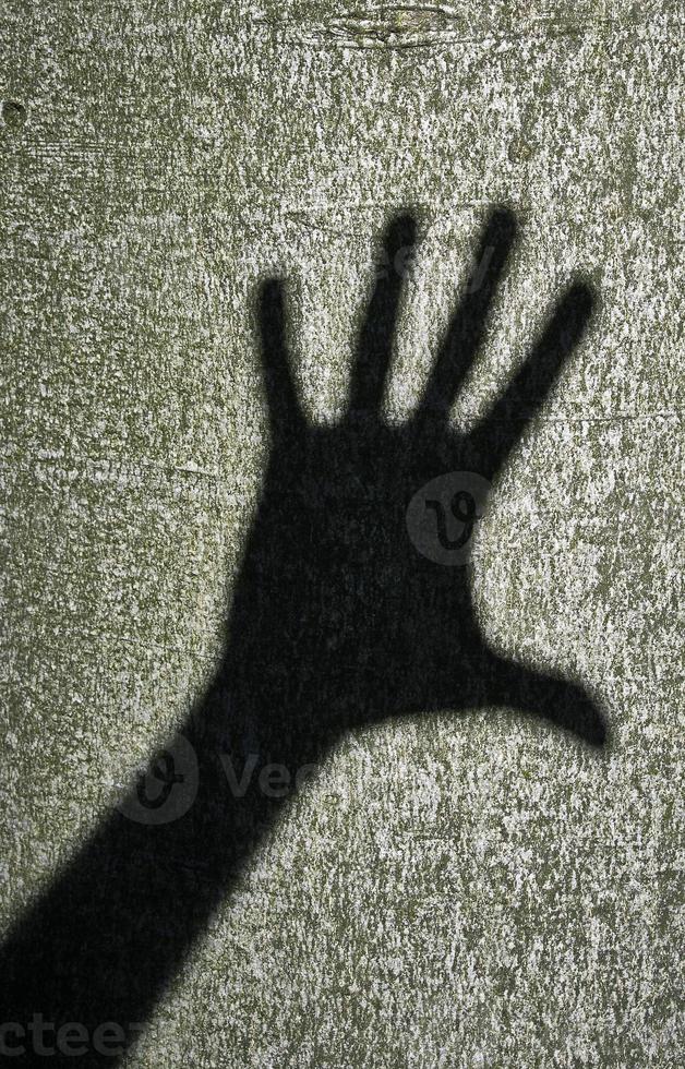 una mano de sombras foto