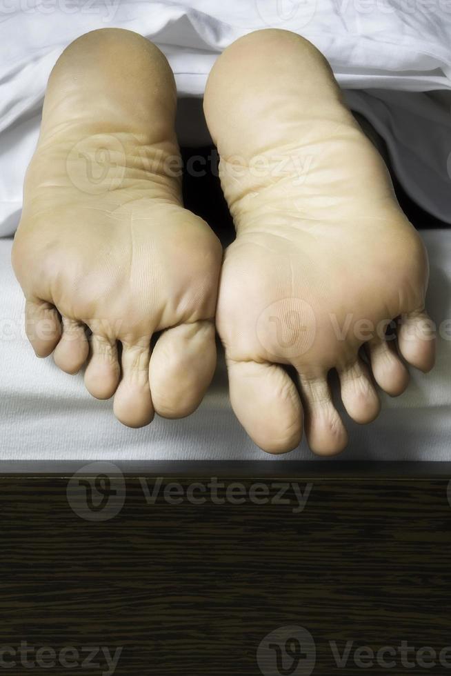 Feet of lying woman photo