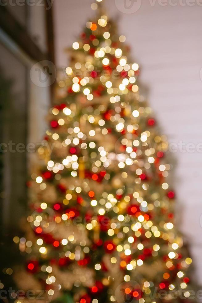 Night blur bokeh on christmas tree, close up photo