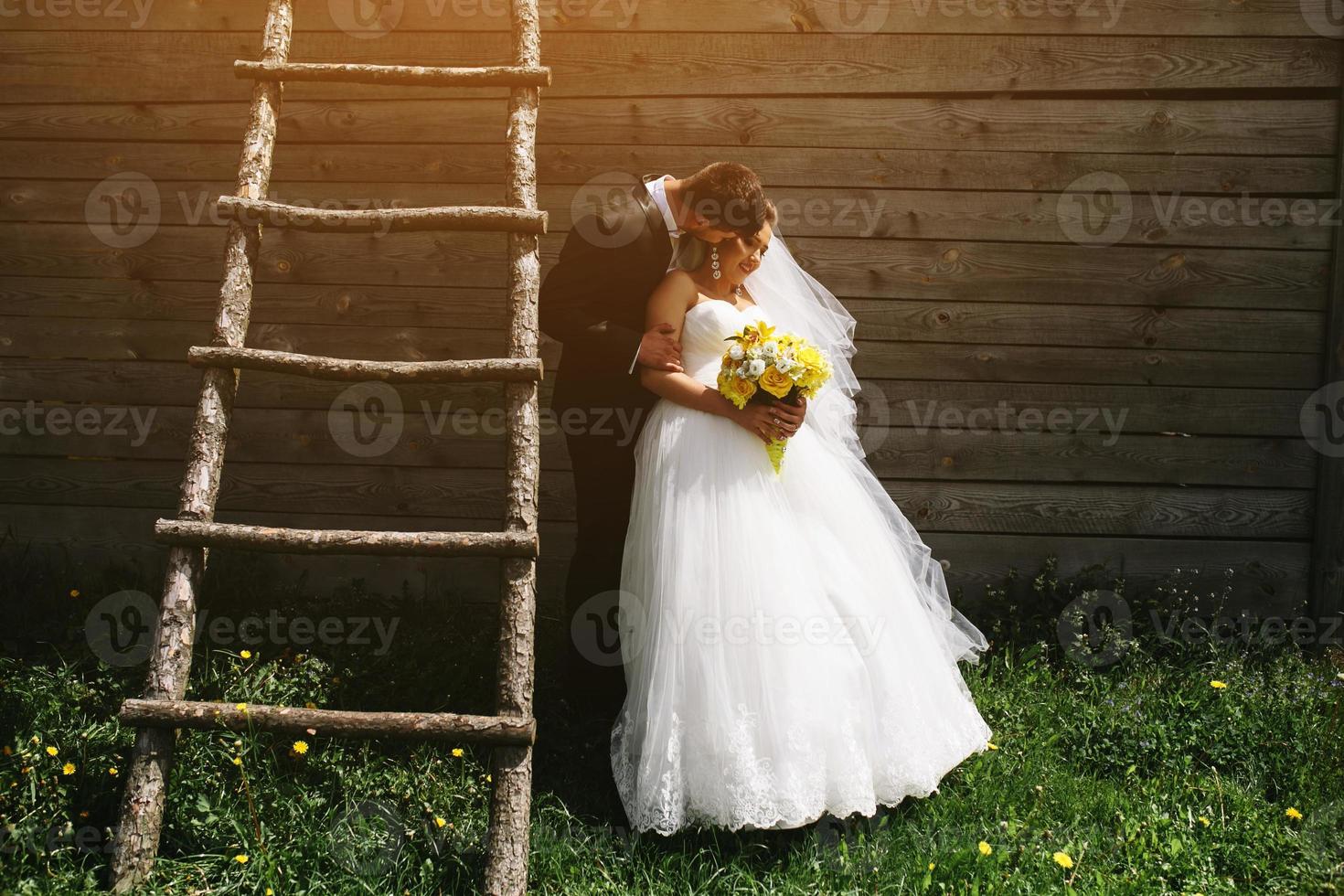 beautiful young wedding couple outdoors photo