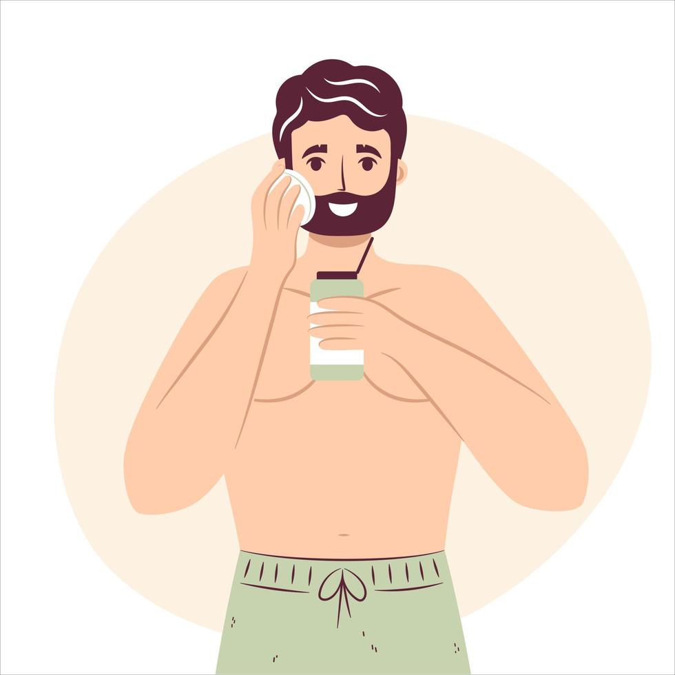 Skincare routine concept. Happy young man using cotton pad removing makeup, aftershave cosmetics or tonic, handsome bearded male enjoying skincare procedure. Men hygiene vector