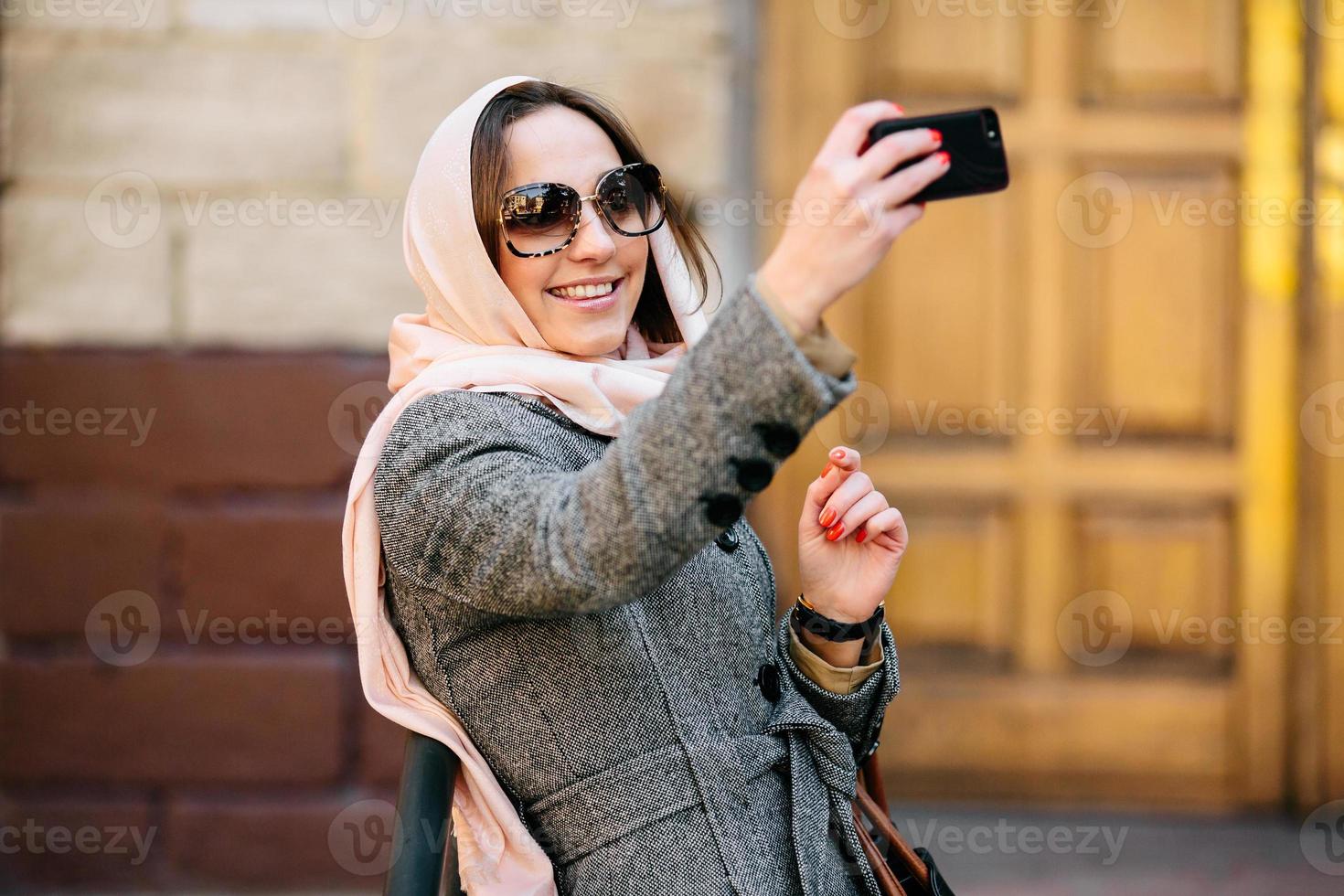 girl in a coat on the street photo