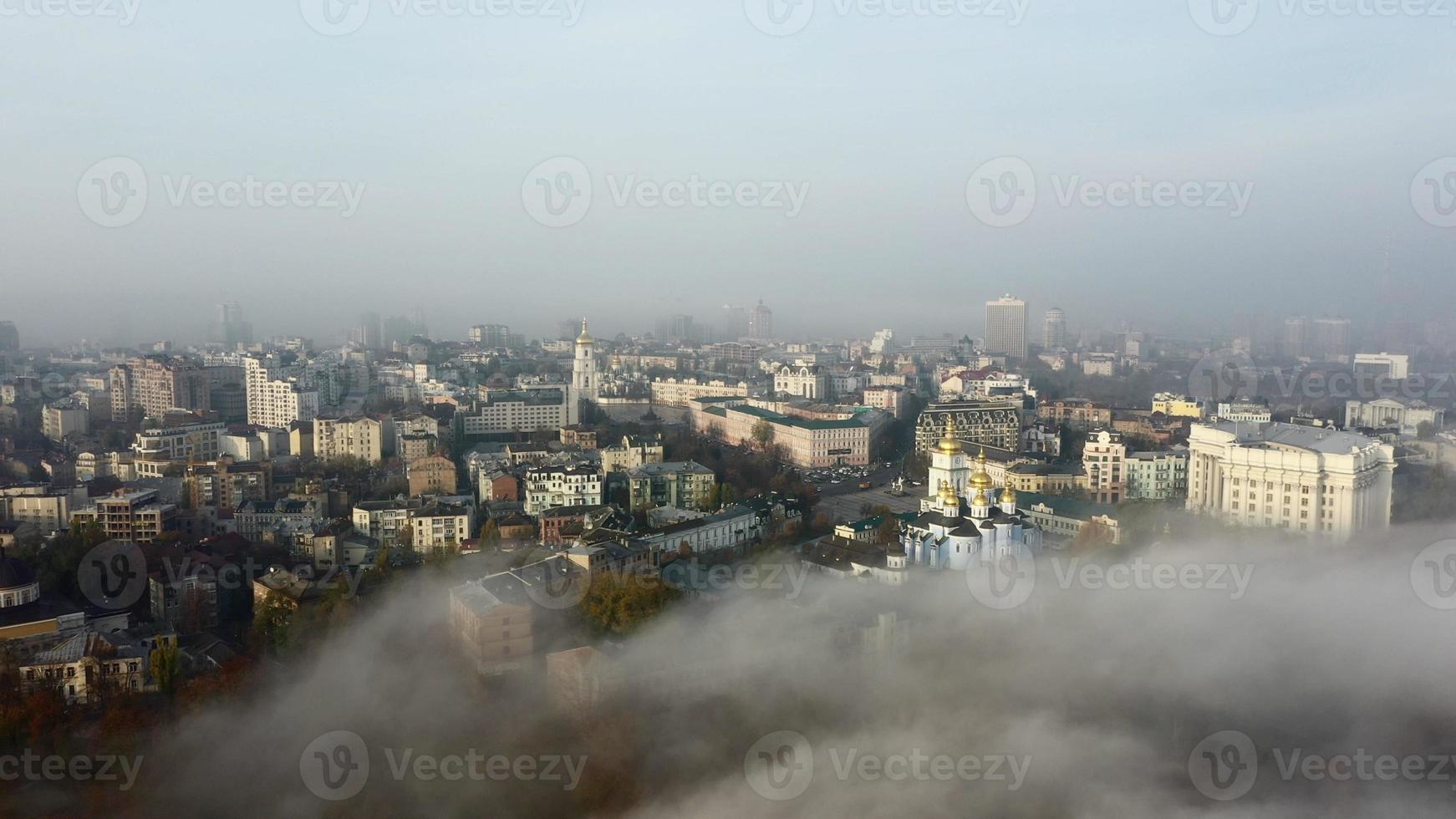 Aerial view of the city in the fog. photo