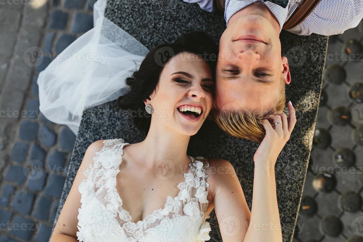 Bride and groom having fun photo