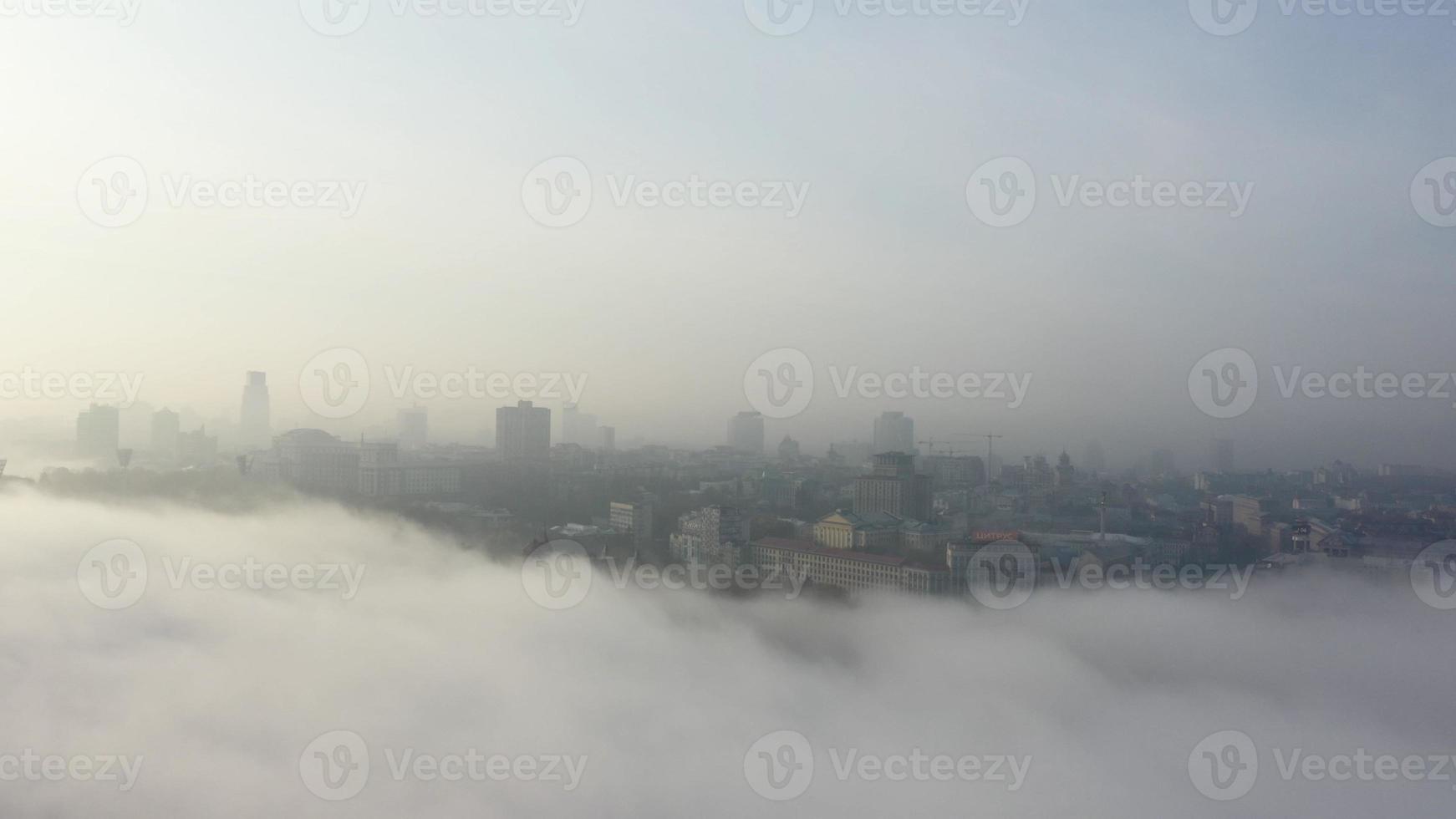 Aerial view of the city in the fog. photo