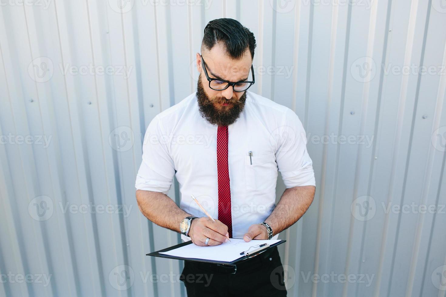 businessman signs a document photo