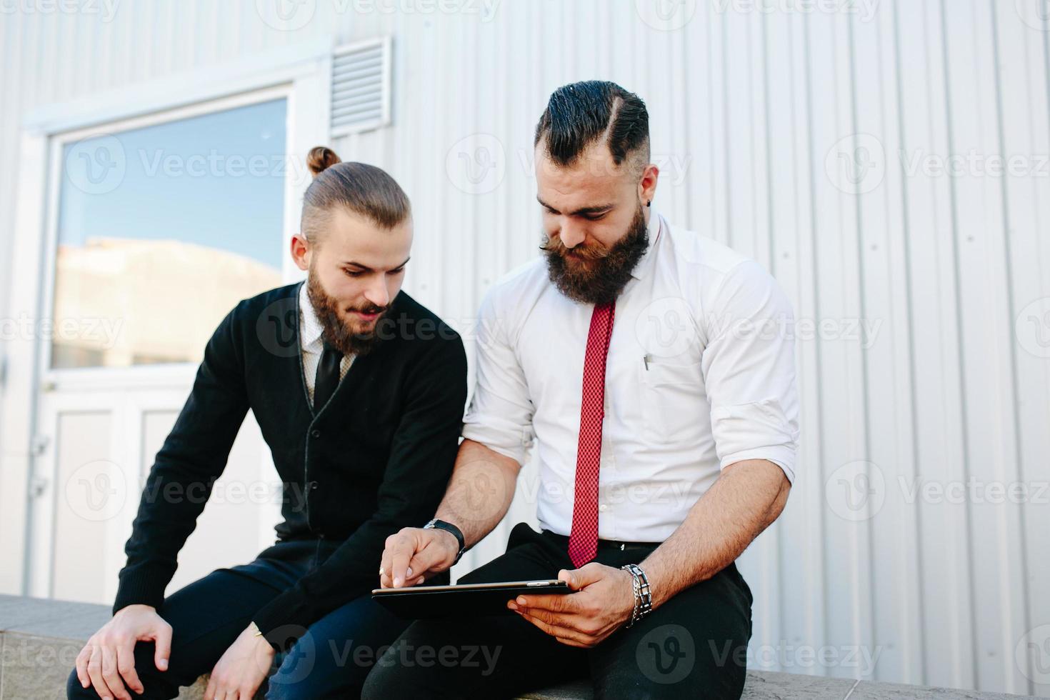 Two businessmen discussing something photo