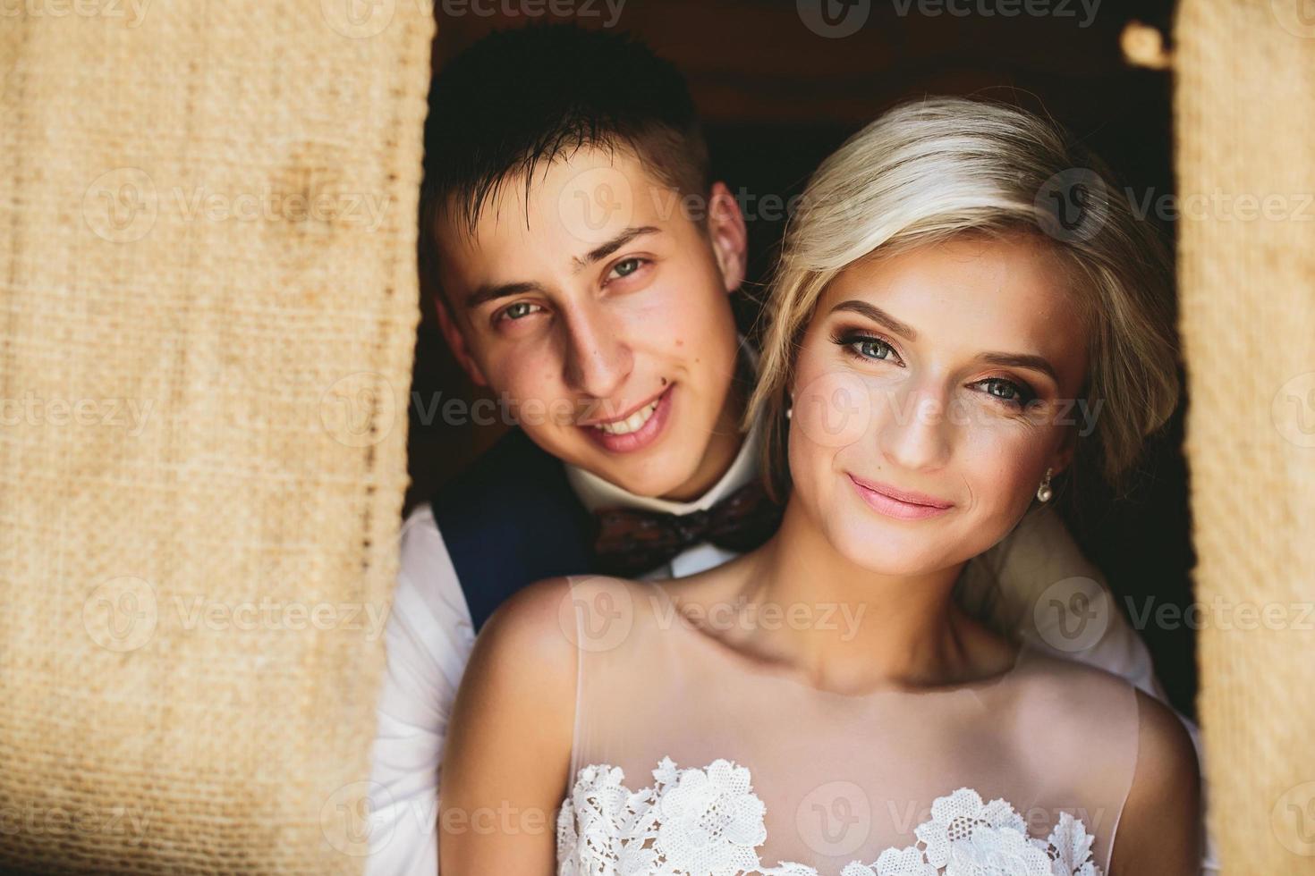 Beautiful wedding couple in doorway photo