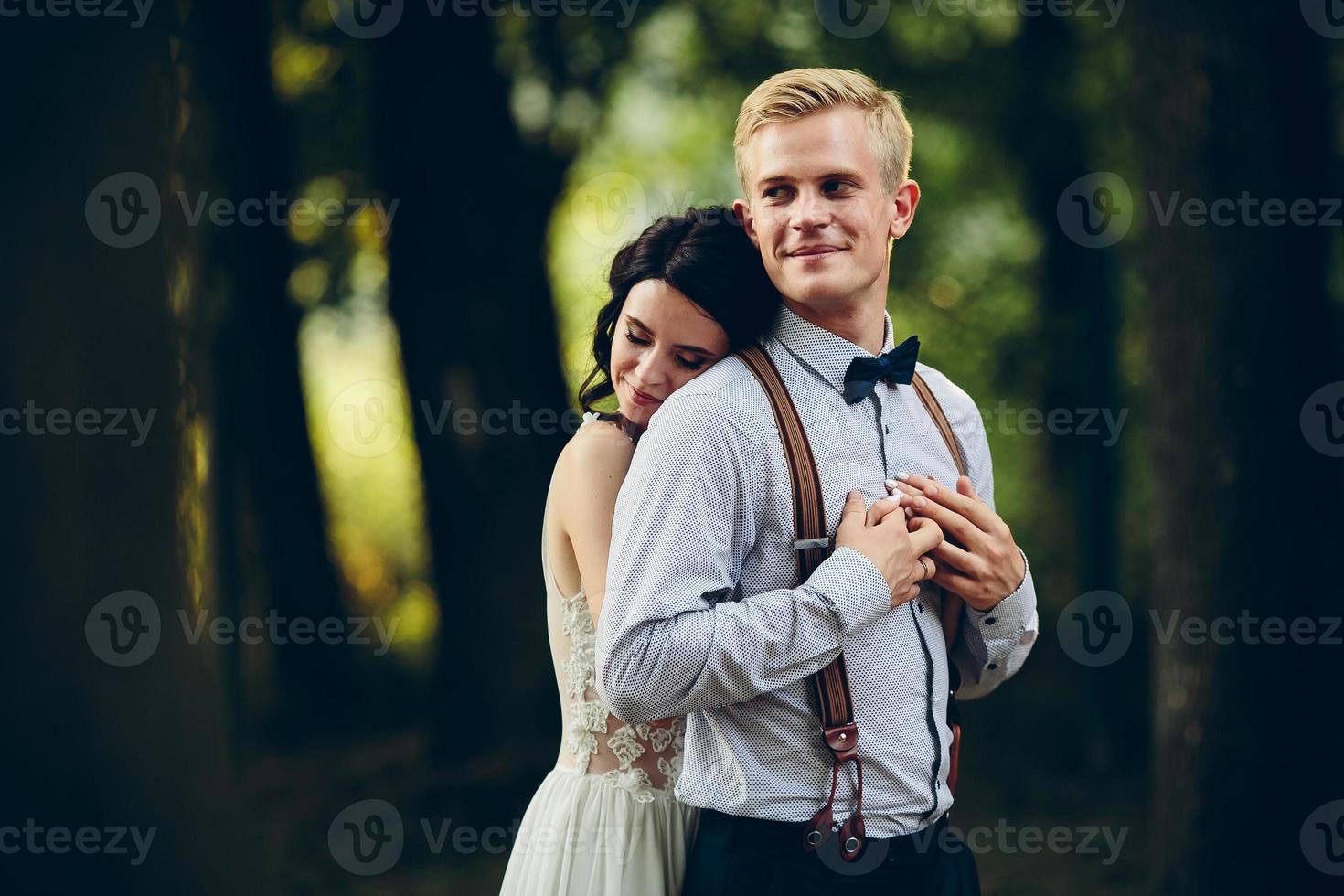 Beautiful wedding couple posing photo