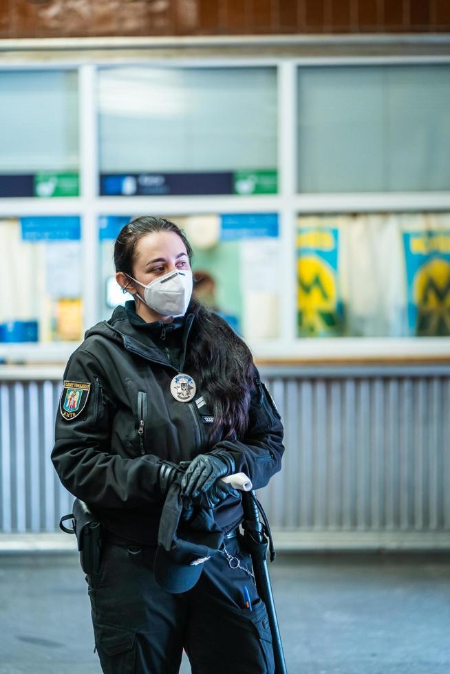 UKRAINE, KIEV - MAY 26, 2020 subway station Zoloty Vorota Golden Gate. Security people checks the flow of passengers in the metro station photo