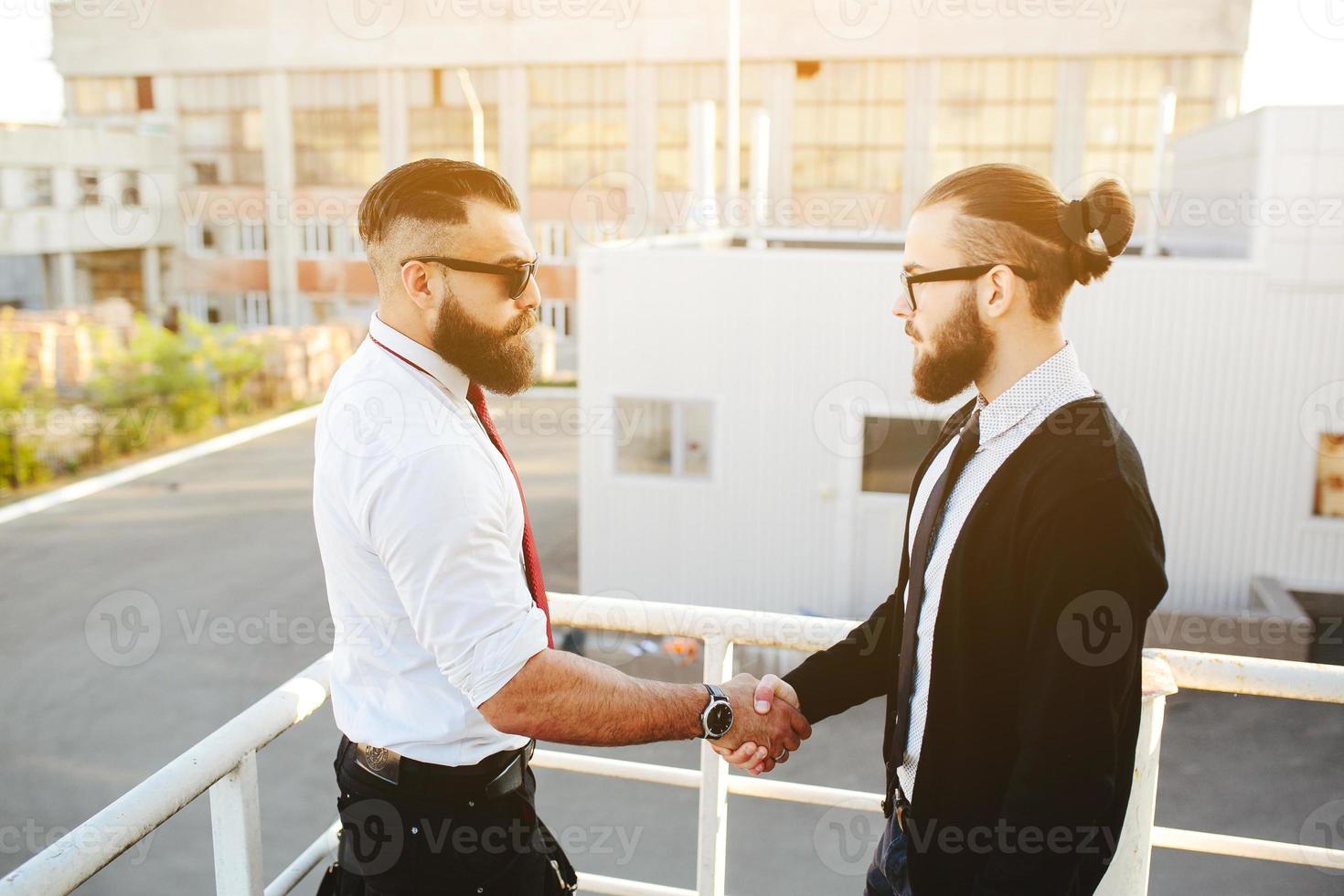 Two businessmen shaking hands photo