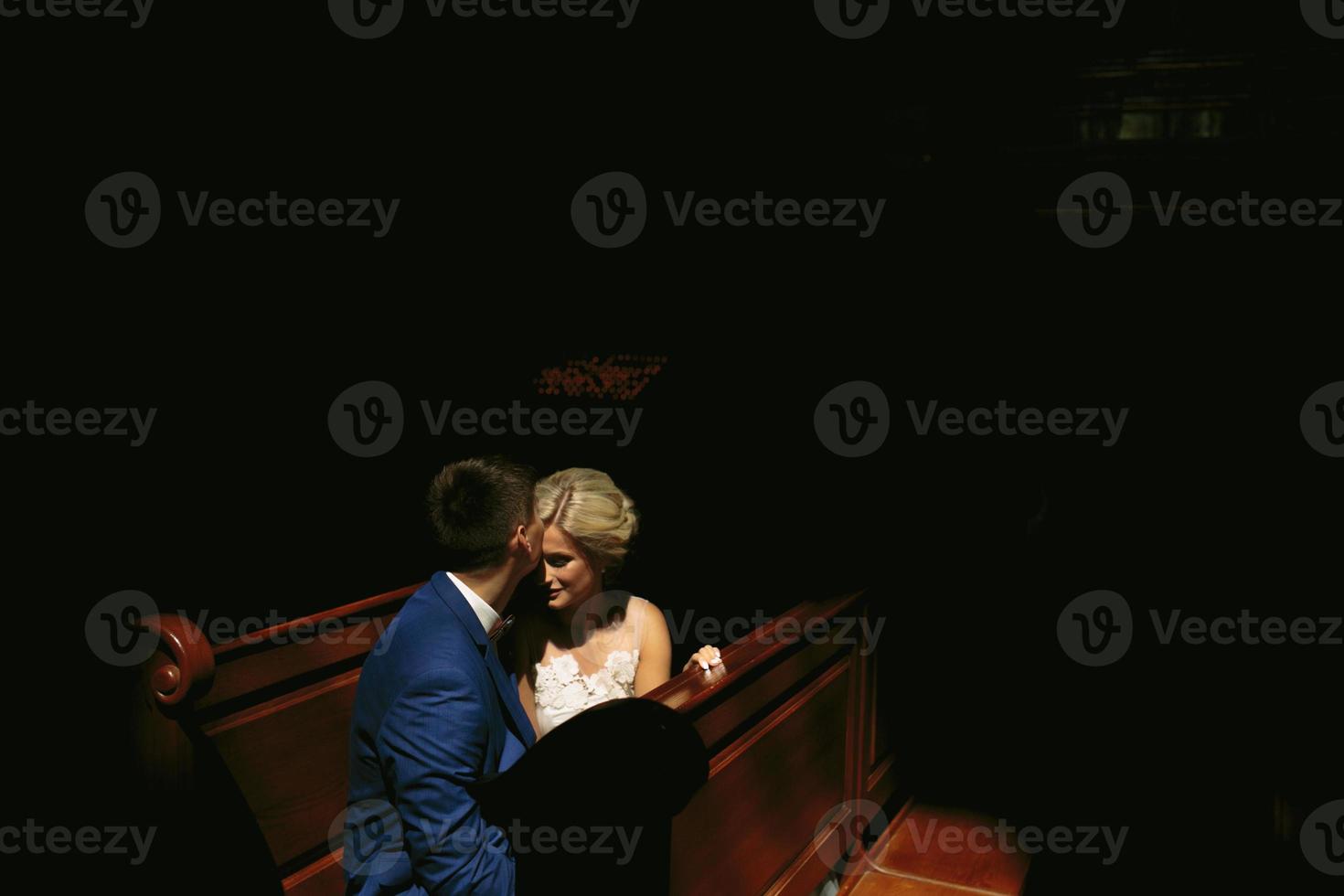 bride and groom illuminated by light photo