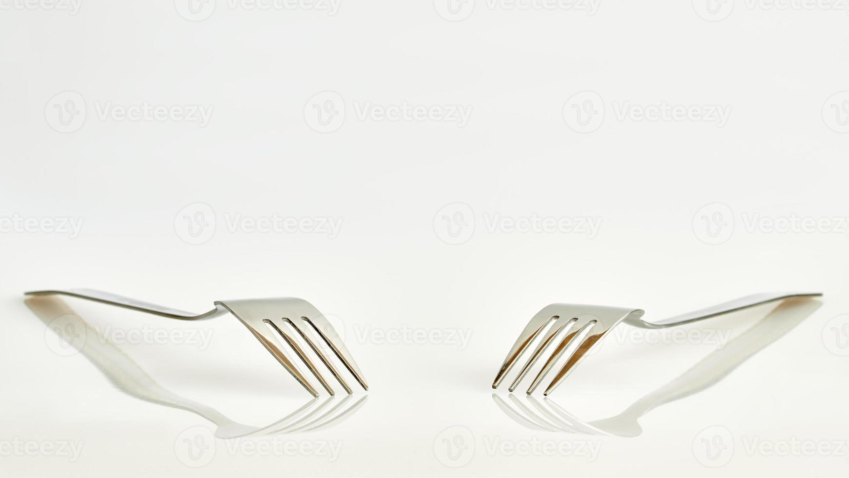 Two forks and reflection photo