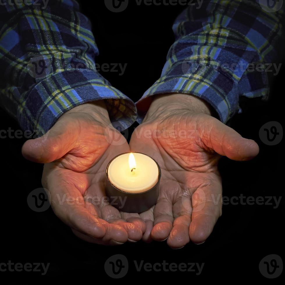 Hands and candle photo
