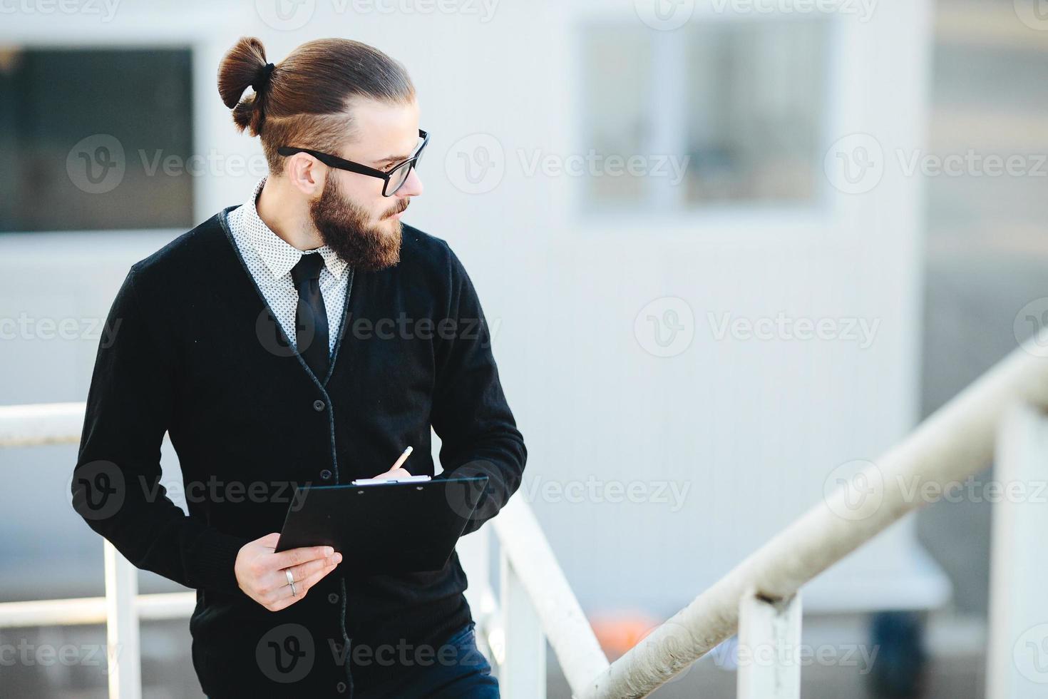 businessman stands with documents in hand 11519639 Stock Photo at Vecteezy