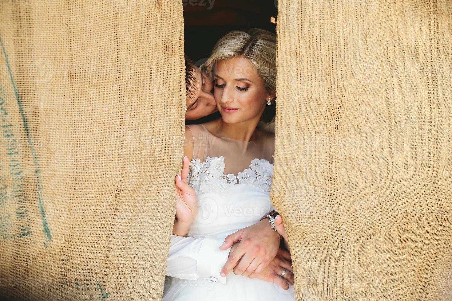 Beautiful wedding couple in doorway photo