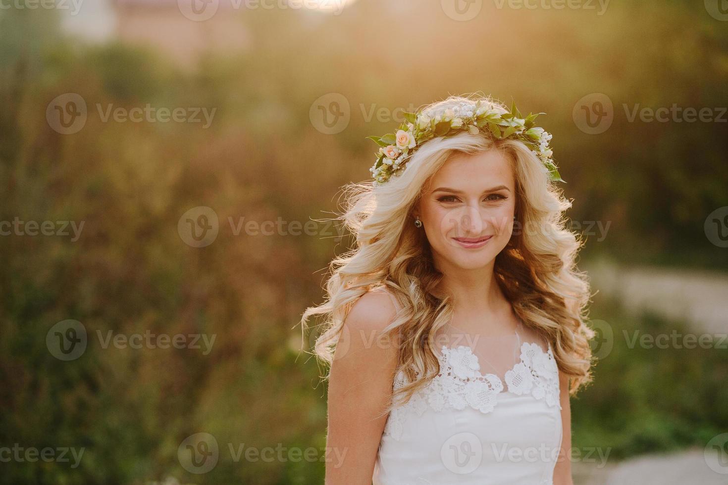 Beautiful model girl in a white wedding dress photo