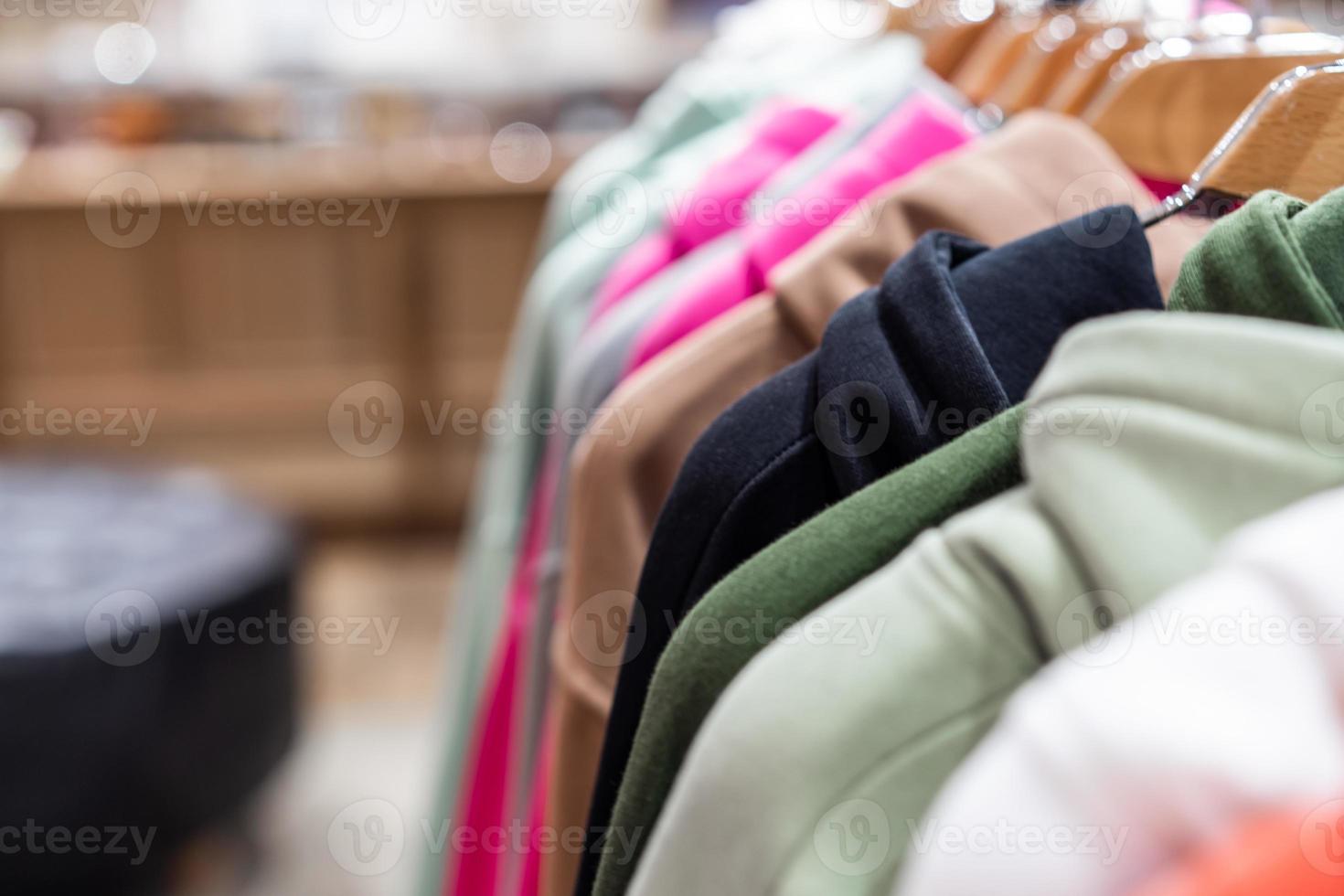 fashion clothing on hangers at the show photo