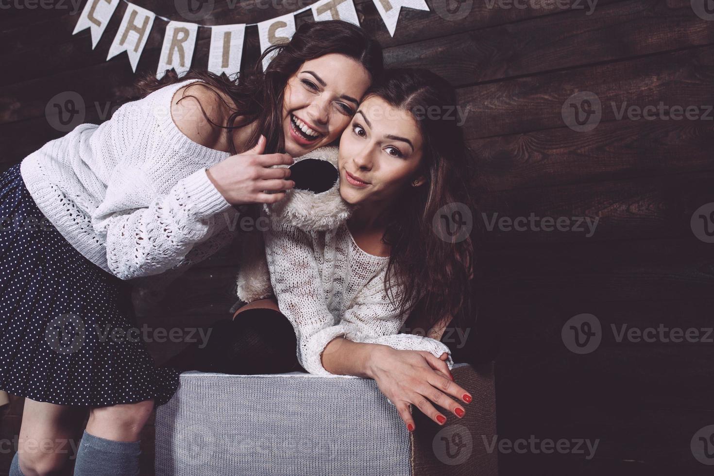 Family New Year's photos, one sister hugging each photo