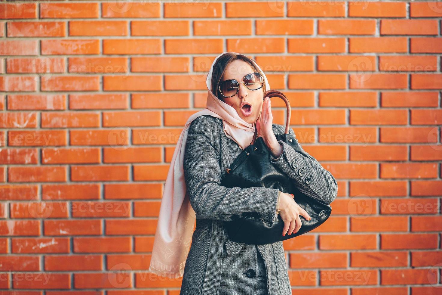 girl in a coat on the street photo