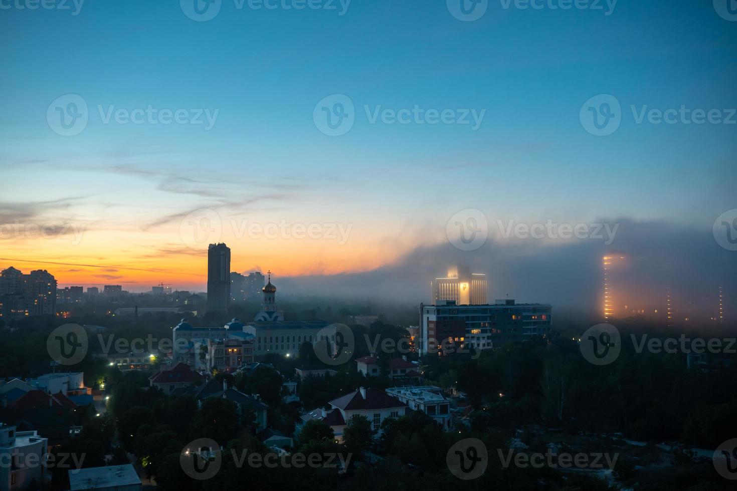 View of residential buildings at the sunset with cloudy sky. photo