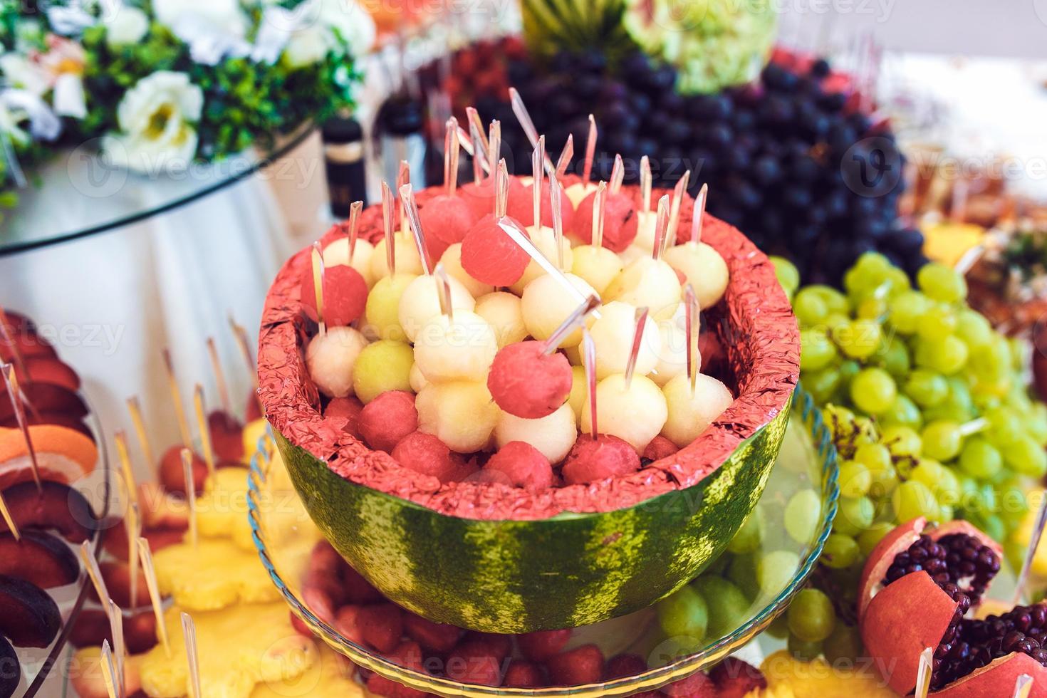 Cocktail with fruits, grapefruit, grapes, apple, pomegranate, watermelon photo