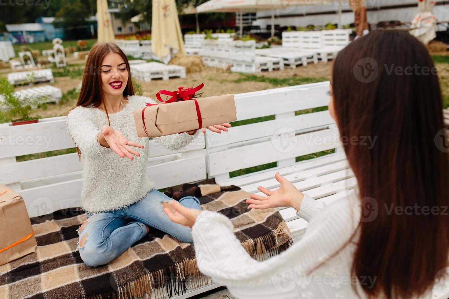 Girls throws gifts to each other photo