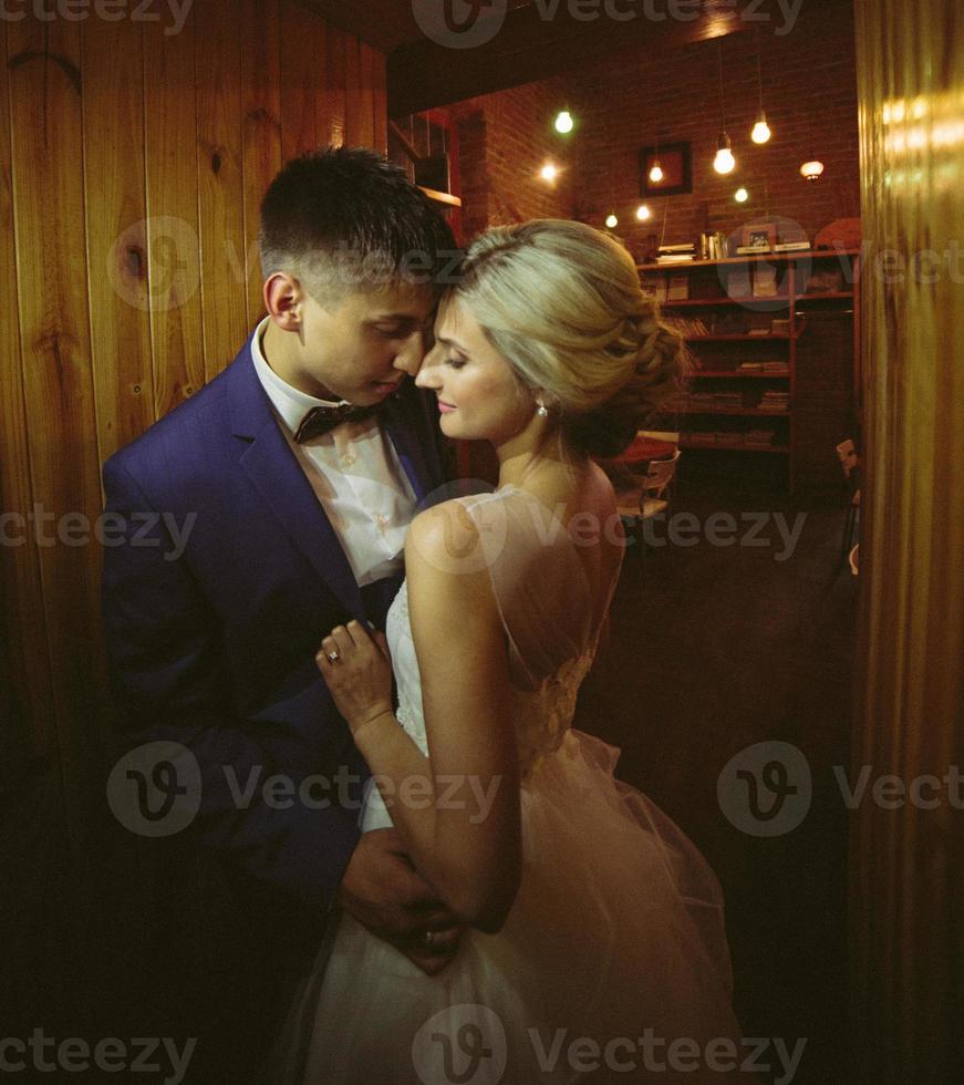 The bride and groom in a cozy house photo